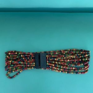 Women’s billabong wooden rainbow beaded belt.